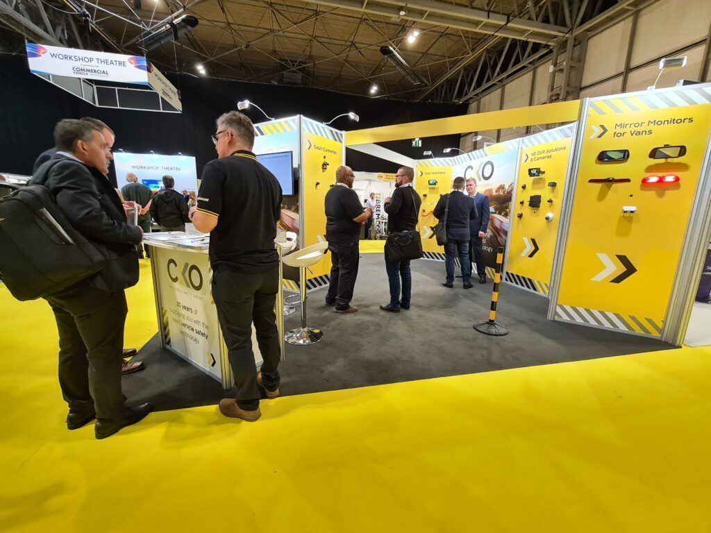 Photo of CKO staff talking to customers at the Commercial Vehicle Show on the CKO exhibition stand.